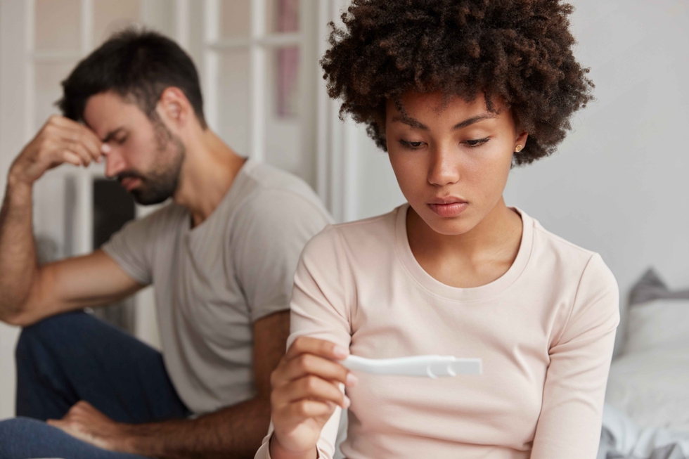Worried_Couple_Checking_Pregnancy_Test_original_1473706.jpg