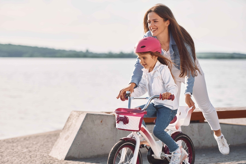 Daughter_Learns_To_Ride_A_Bike_With_Her_Mother_original_3286751.jpg