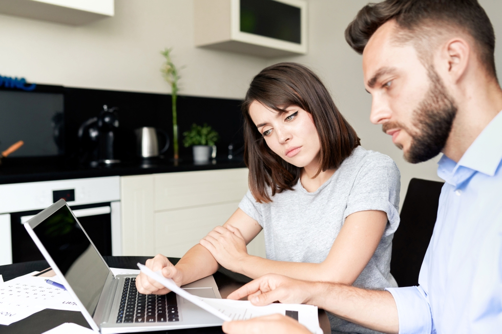 Young_Couple_Examining_Finances_original_439514.jpg