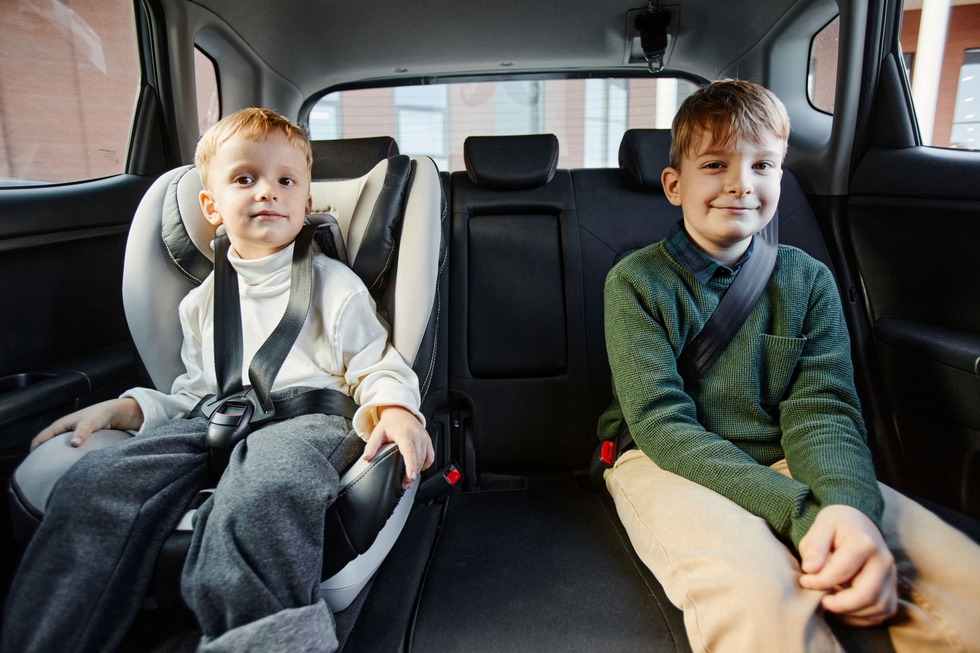 Boys_With_Safety_Belts_In_Car_original_2993420.jpg