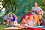 group of happy kids on summer picnic